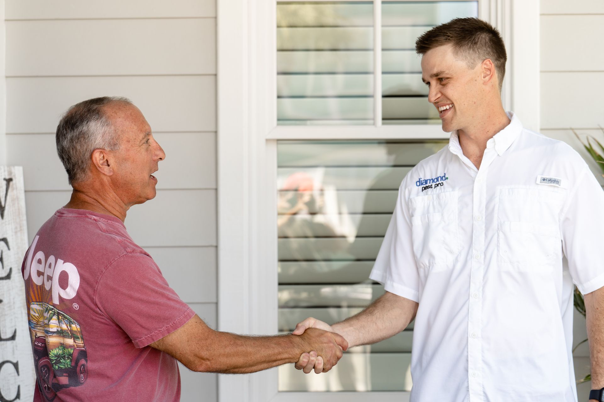 Diamond Pest Pro technician treating a home exterior